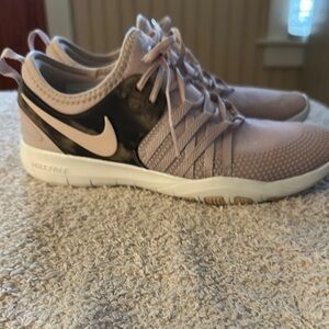 Nike Pink and Black Athletic Shoes with Sleek Design